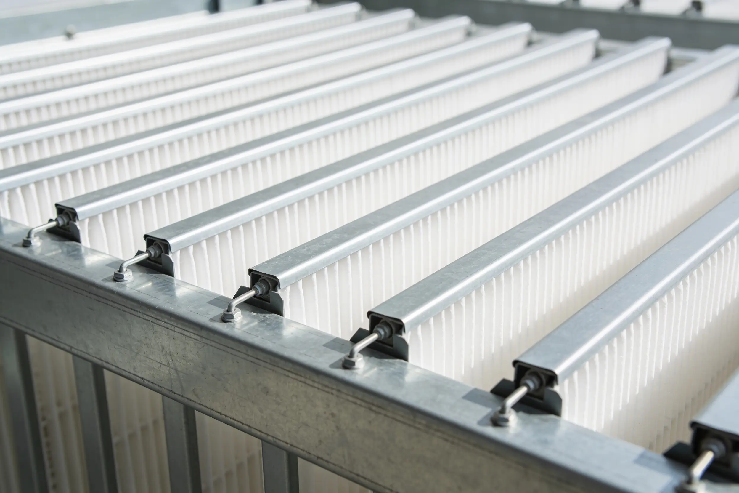 Bank of clean pleated filters seated in a sheet metal filter rack